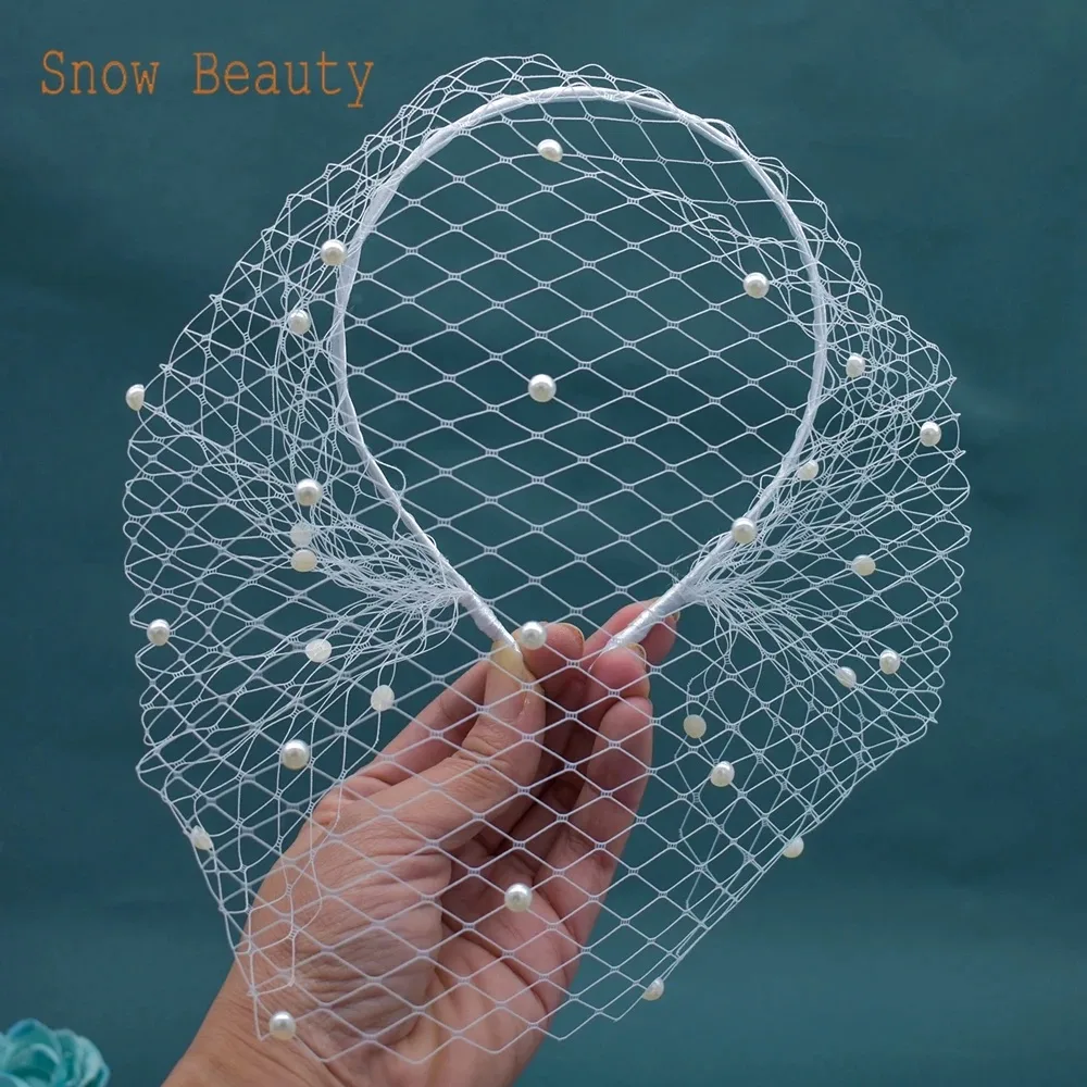 The Birdcage Veil photo 2